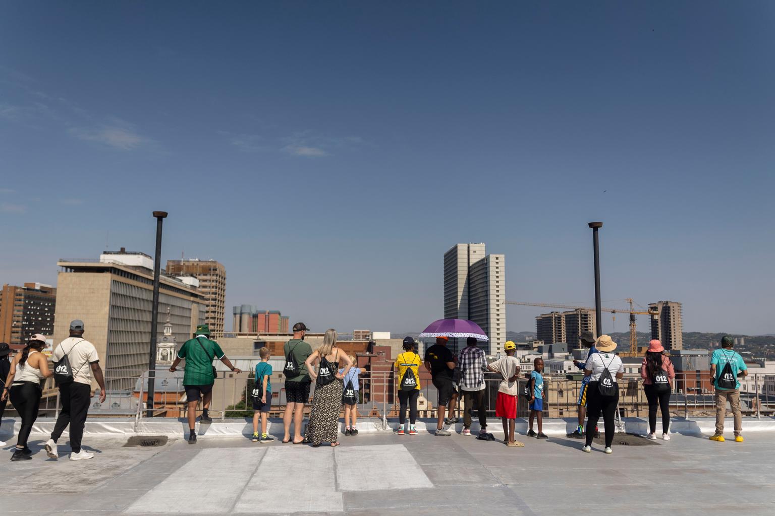 City walkers on the roof of a building next to Church Square