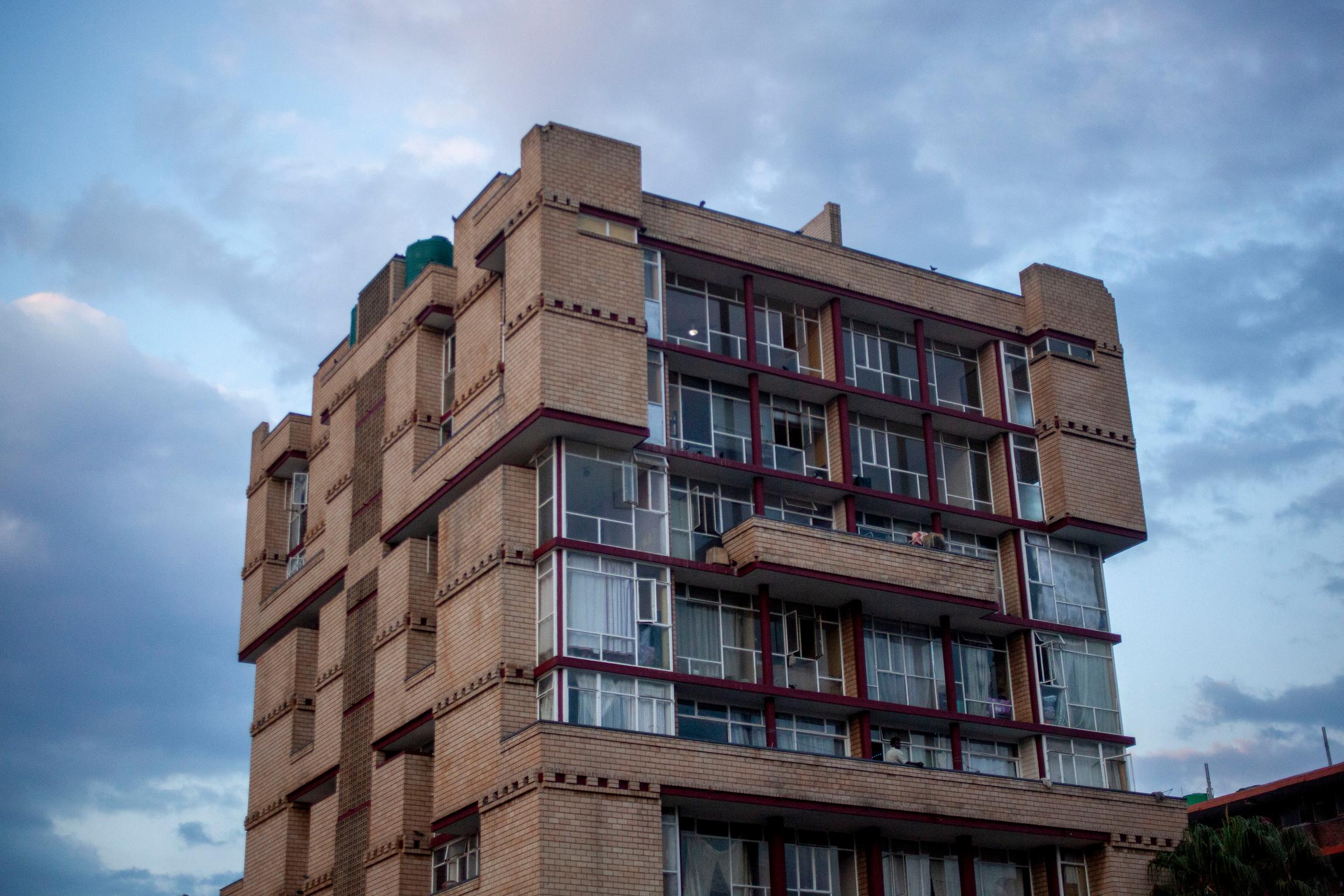 The Quiet Twilight Hour:  A shot of a brick apartment building in Sunnyside during the blue hour. 