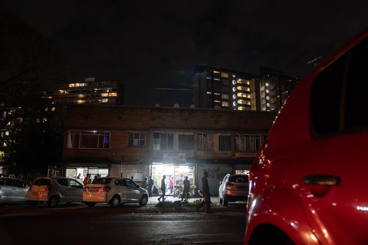 Urban Life Framed:  A nighttime street scene framed